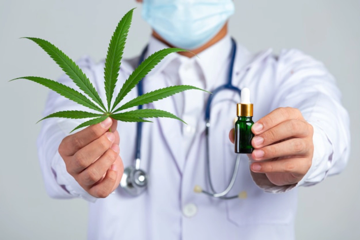 medical-doctor-holding-cannabis-leaf-bottle-cannab